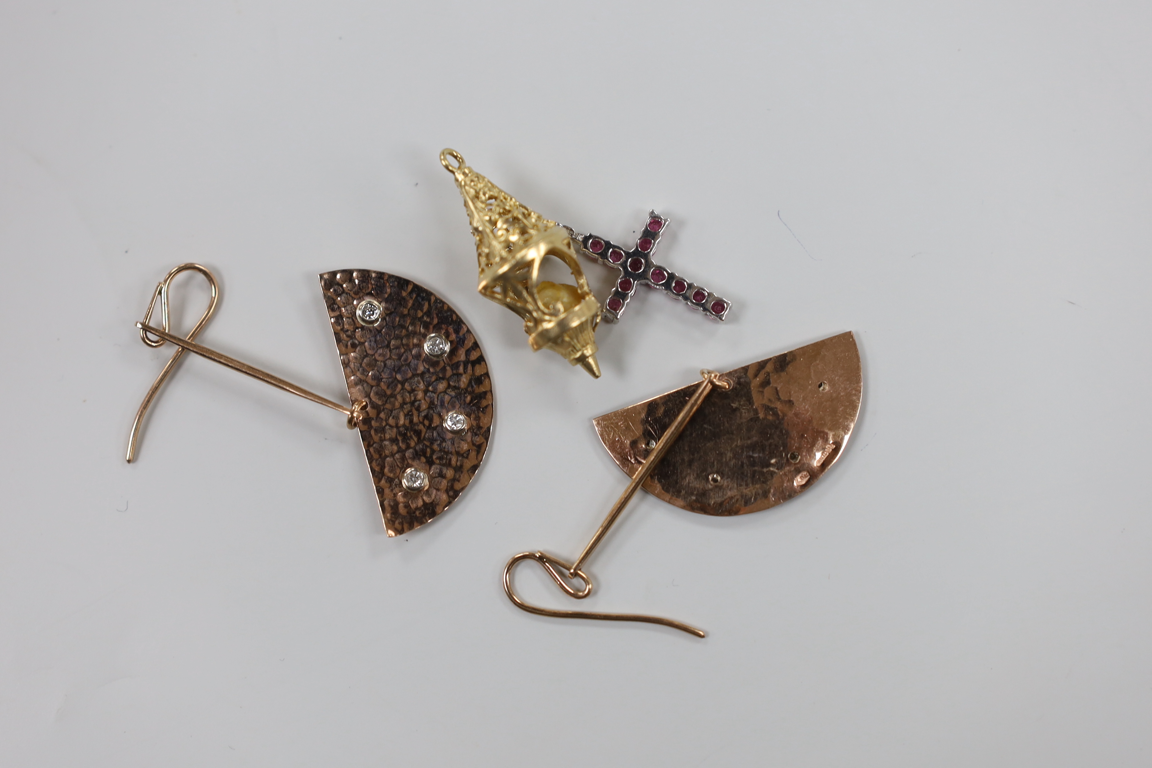 A pair of modern planished 9ct gold and four stone diamond chip set modernist earrings, 54mm, a 9ct white metal and gem set cross pendant and a 9ct gold and cultured pearl charm, gross weight 11.6 grams.